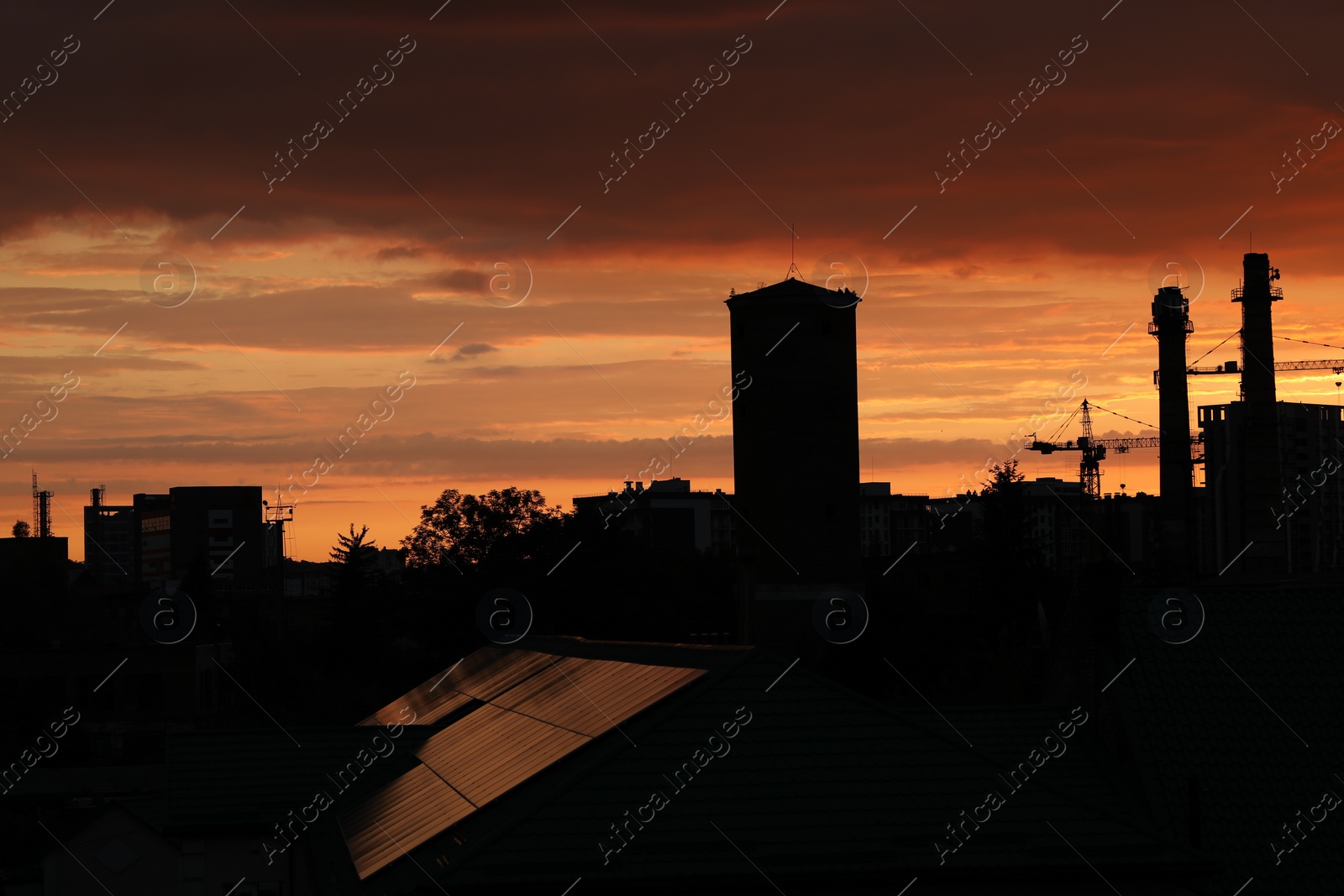 Photo of Picturesque view of sky with clouds over city at sunset