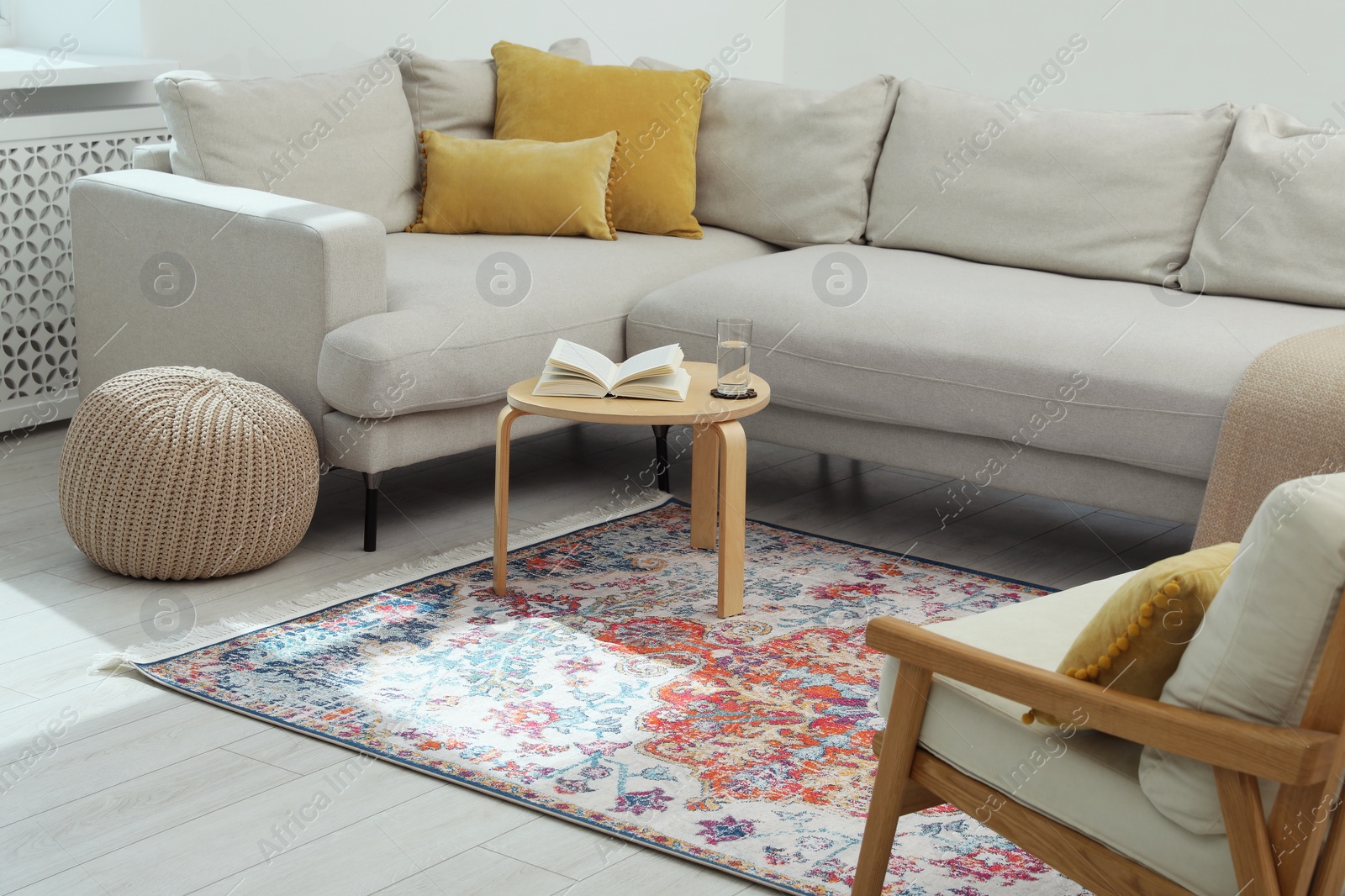 Photo of Stylish living room with beautiful carpet and furniture. Interior design