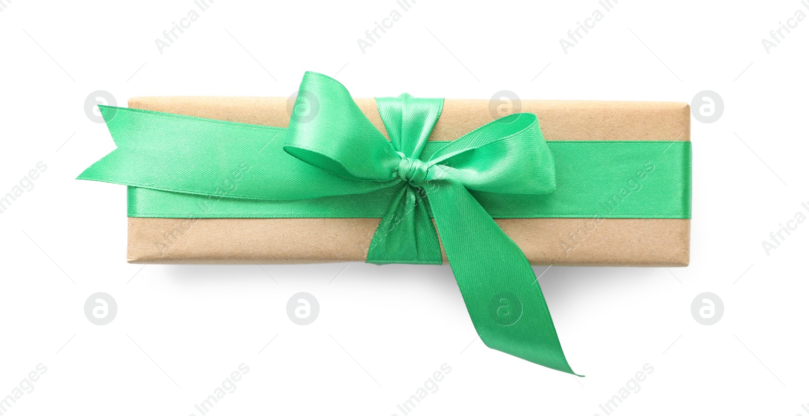 Photo of Christmas gift box decorated with green bow isolated on white, top view