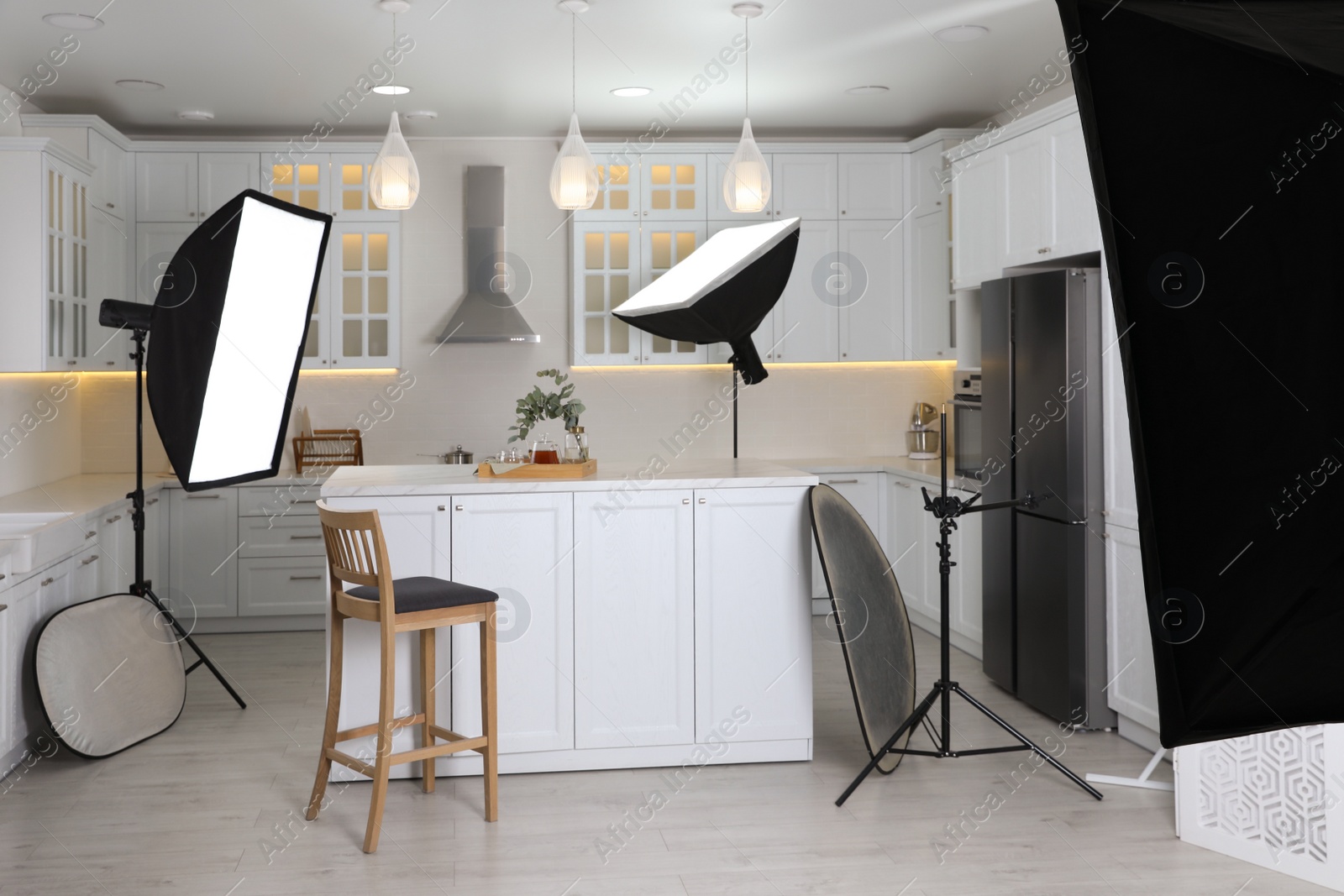 Photo of Professional photo studio equipment prepared for shooting kitchen interior