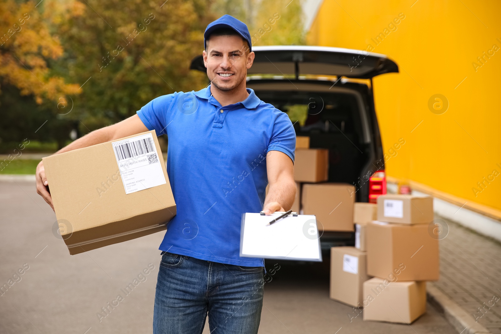 Photo of Courier with clipboard and parcel near delivery van outdoors. Space for text