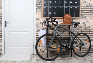 Photo of Modern bicycle in stylish hallway interior