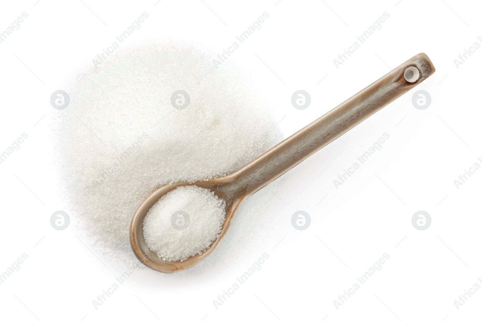 Photo of Spoon with granulated sugar isolated on white, top view