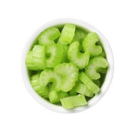 Photo of Bowl of fresh cut celery isolated on white, top view