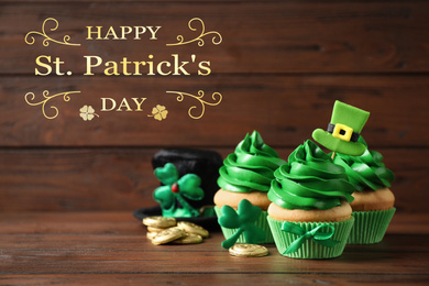 Decorated cupcakes and coins on wooden table. St. Patrick's Day celebration