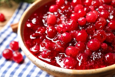 Photo of Fresh cranberry sauce served in bowl, closeup