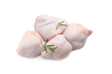 Photo of Raw chicken thighs with rosemary on white background, top view