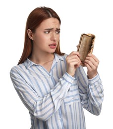 Photo of Confused woman with empty wallet on white background