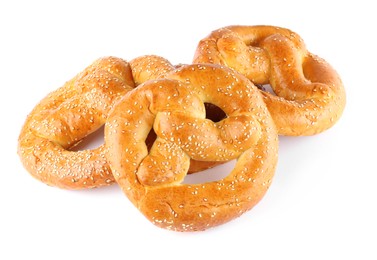 Photo of Tasty freshly baked pretzels on white background