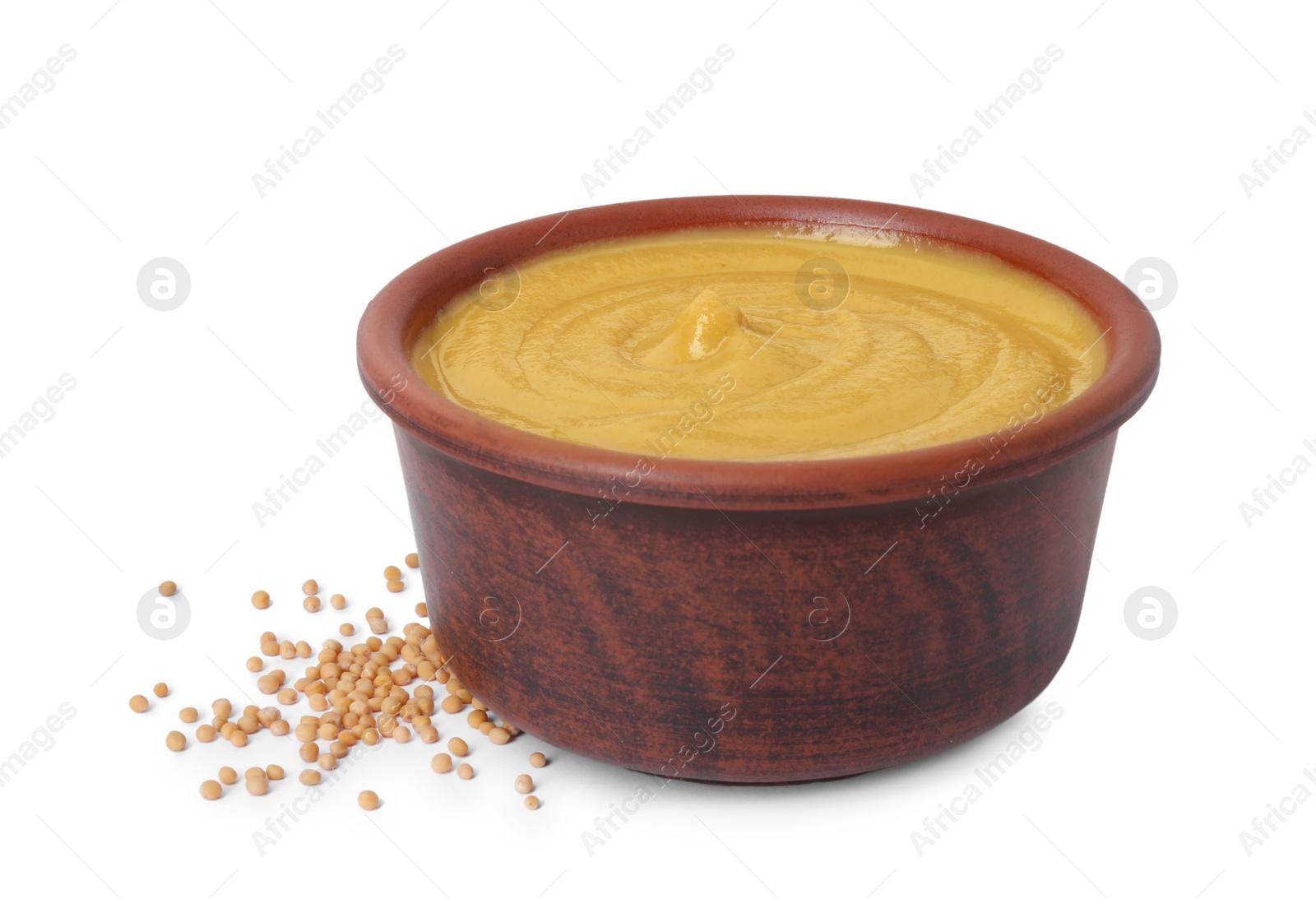 Photo of Fresh tasty mustard sauce in bowl and dry seeds isolated on white