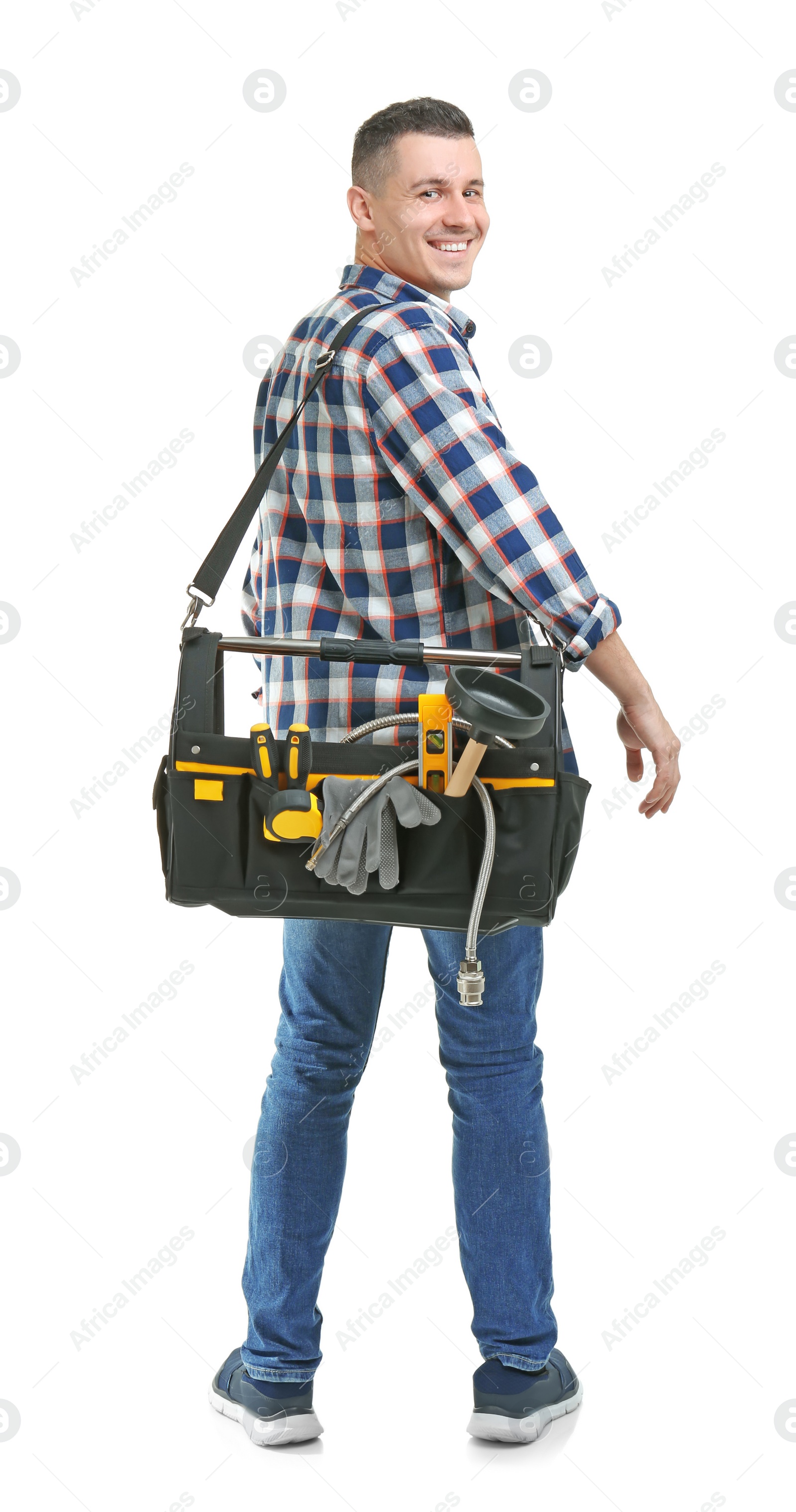 Photo of Young plumber with tool bag on white background