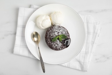 Photo of Delicious fresh fondant with hot chocolate, mint and ice cream served on white table, top view