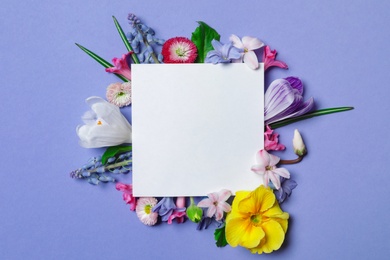 Photo of Flat lay composition with spring hyacinth flowers and blank card on color background, space for text