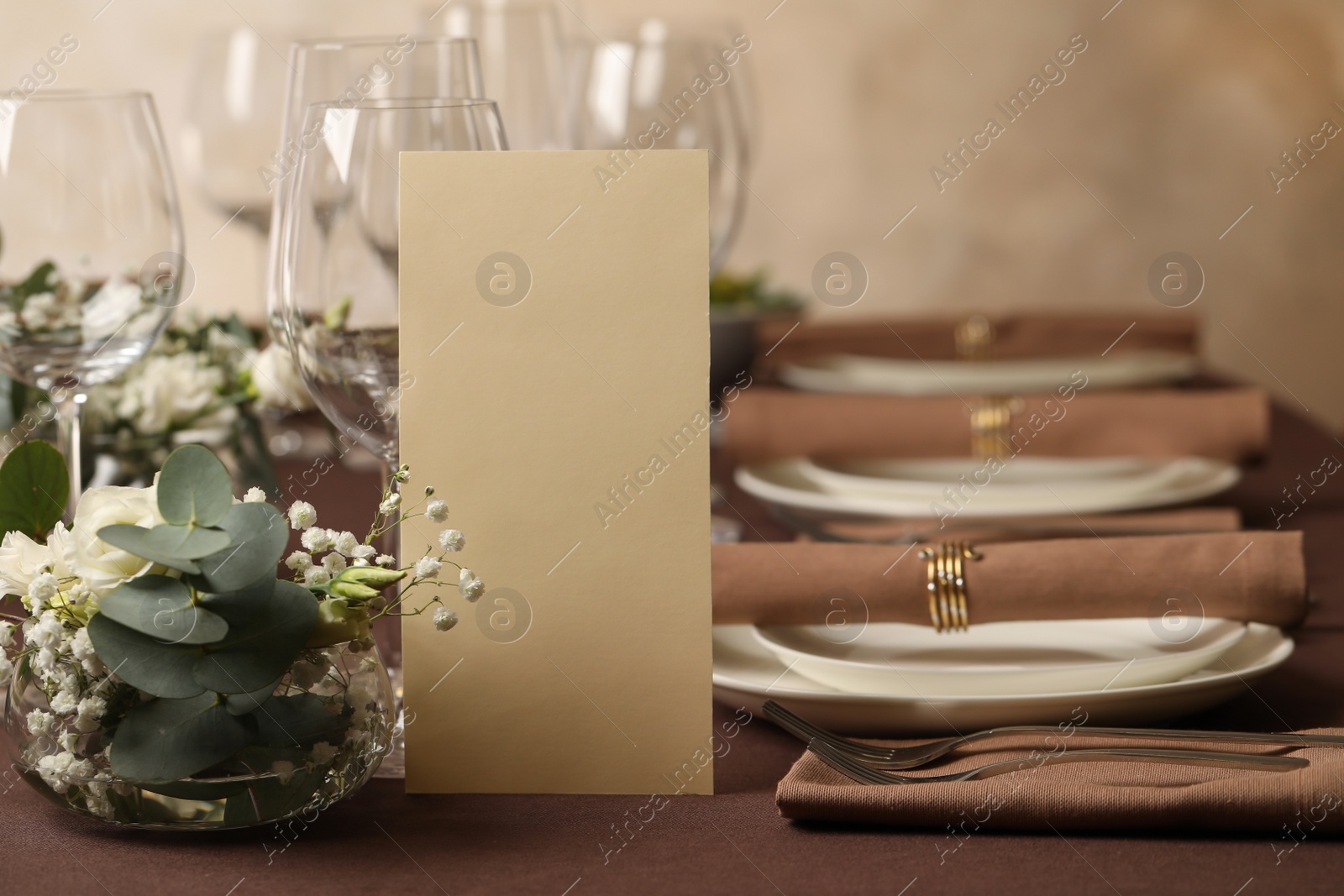 Photo of Stylish elegant table setting for festive dinner in restaurant