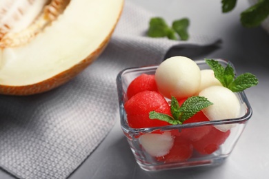 Bowl with melon and watermelon balls on table