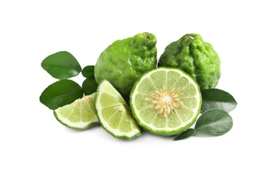 Photo of Fresh ripe bergamot fruits and green leaves on white background