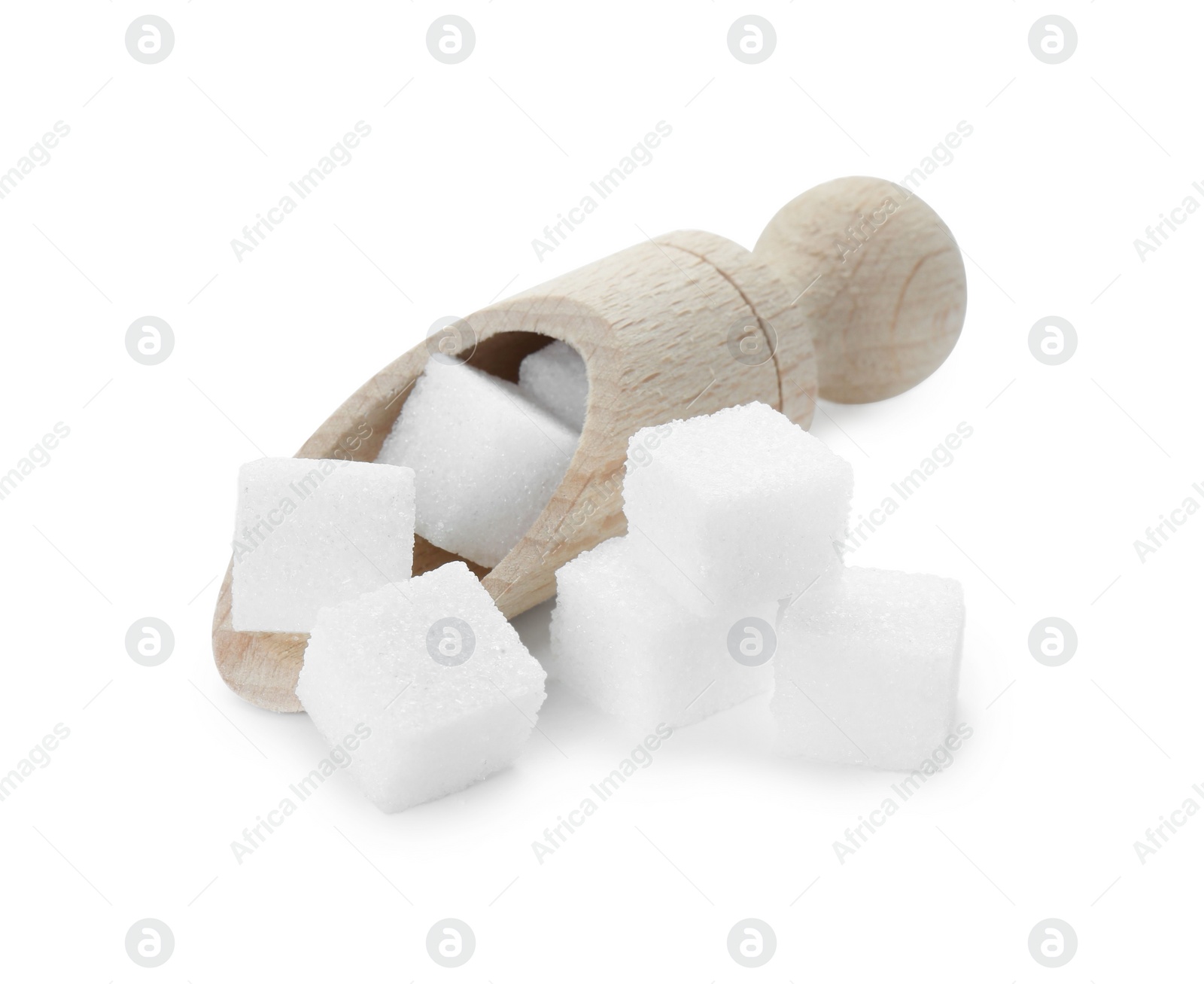 Photo of Sugar cubes and wooden scoop isolated on white