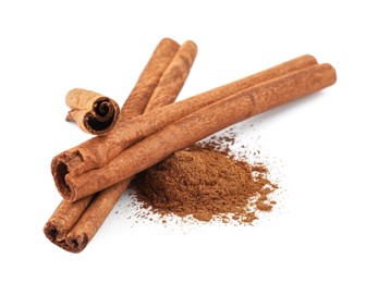 Dry aromatic cinnamon sticks and powder isolated on white