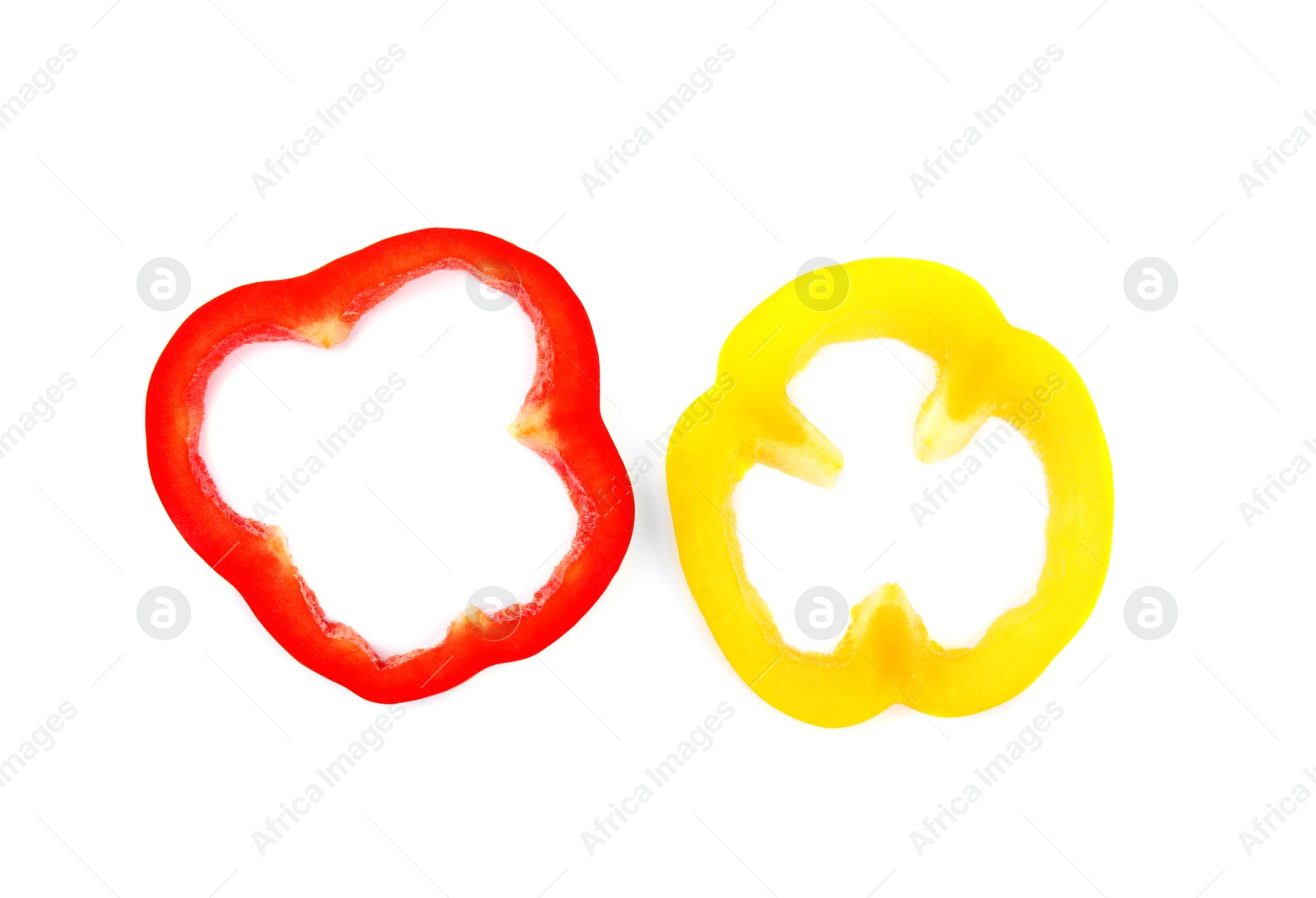 Photo of Rings of ripe bell peppers on white background