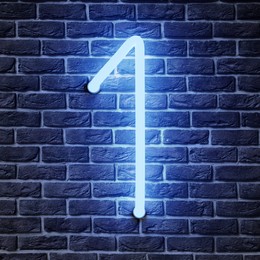 Image of Glowing neon number 1 sign on brick wall