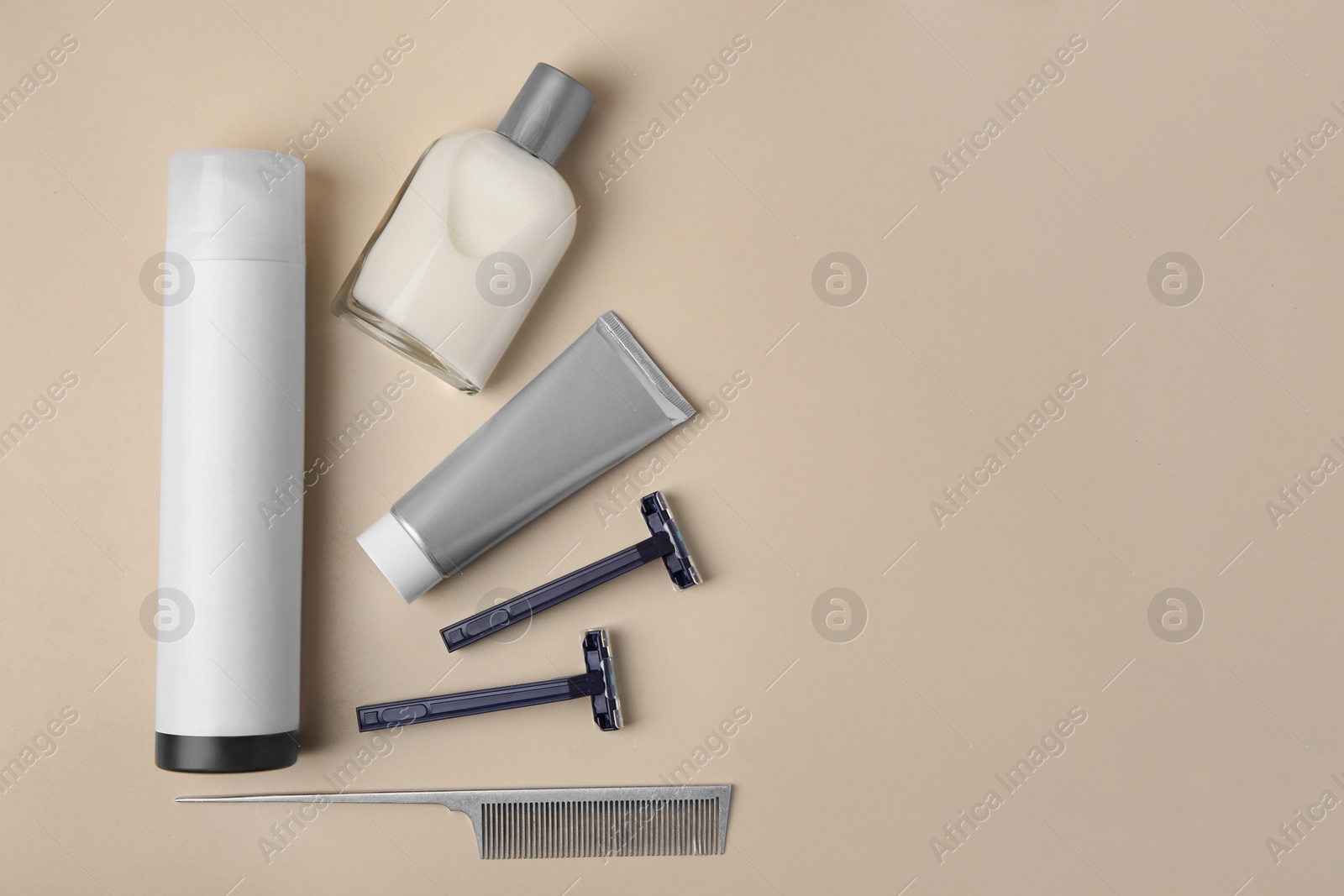 Photo of Flat lay composition with shaving accessories for men on beige background. Space for text