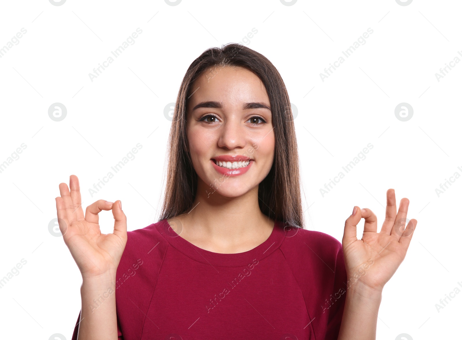 Photo of Woman showing OK gesture in sign language on white background