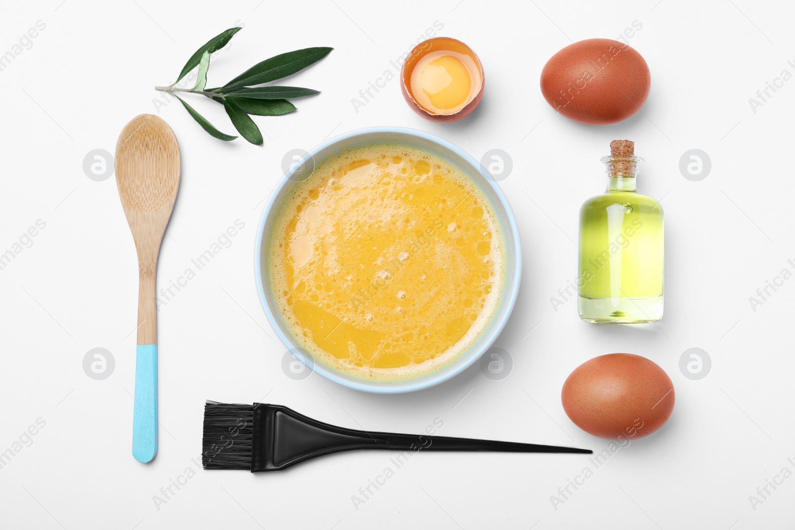 Photo of Homemade hair mask, brush and ingredients on white background, flat lay