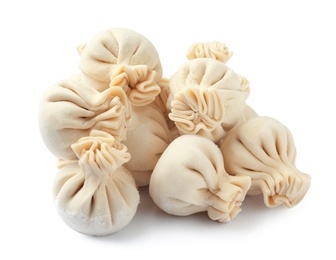 Photo of Pile of raw dumplings on white background