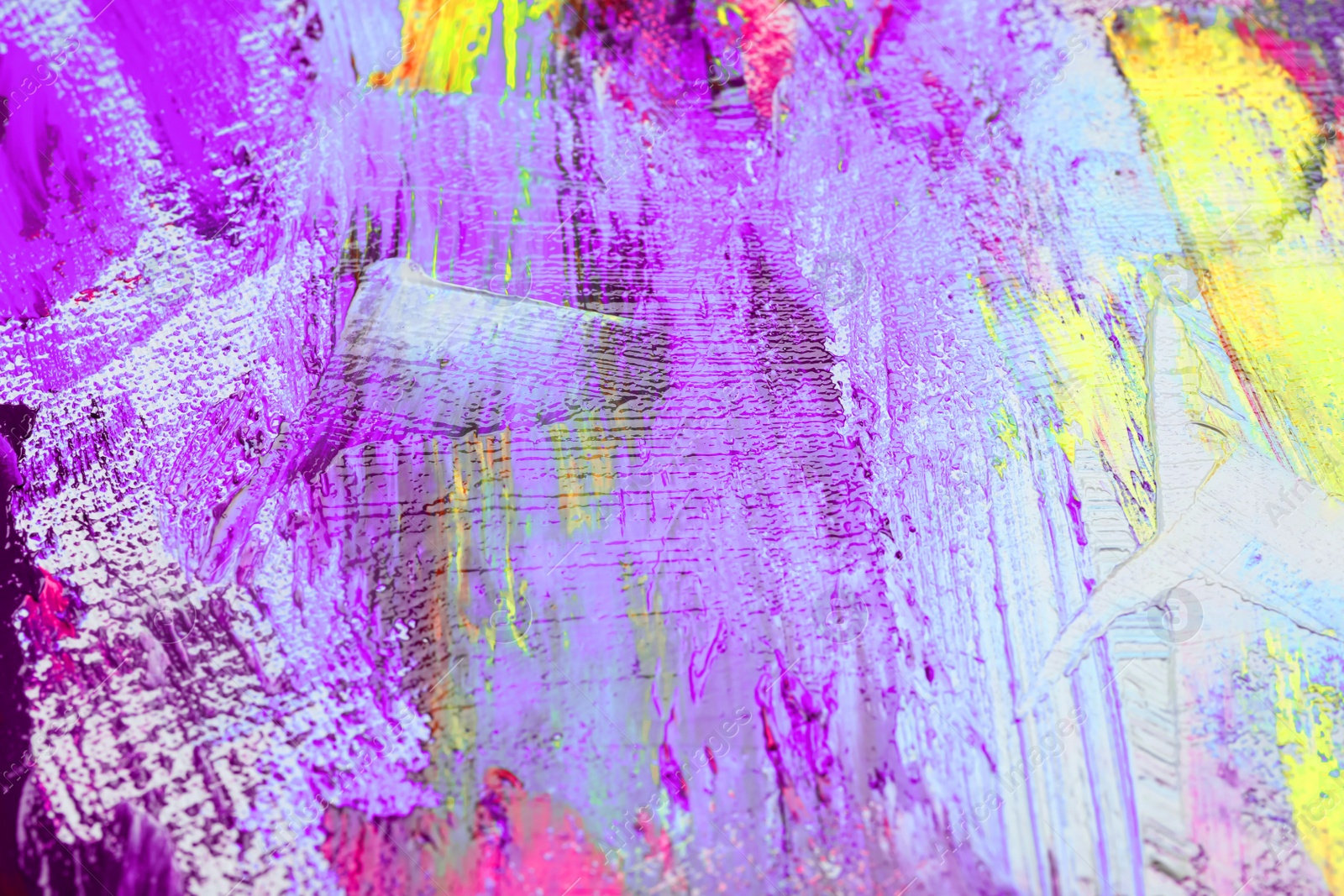 Image of Strokes of colorful acrylic paints on canvas, closeup