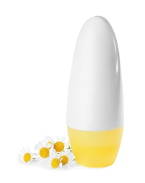Photo of Natural female roll-on deodorant with chamomile flowers on white background