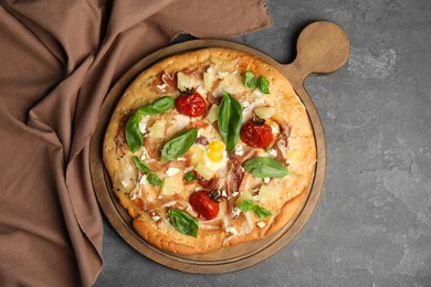 Photo of Delicious homemade pita pizza on grey table, top view