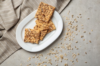 Plate with grain cereal cookies on table, top view. Healthy snack