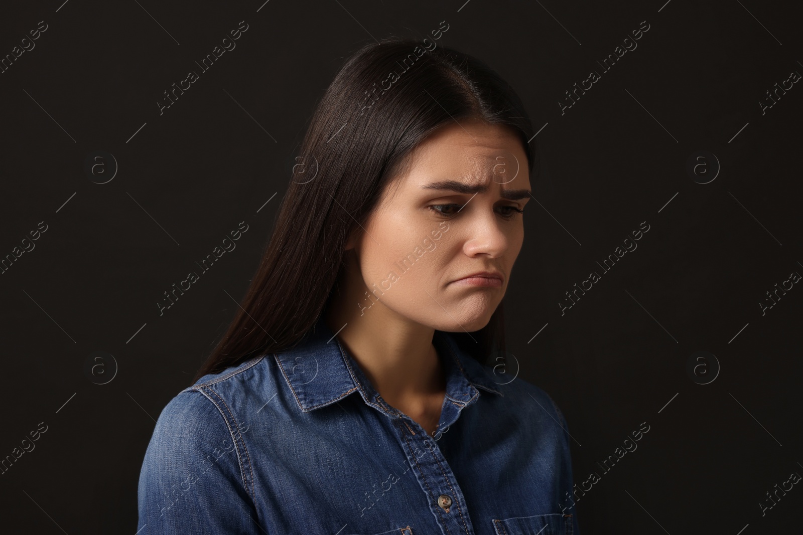 Photo of Personality concept. Emotional woman on black background