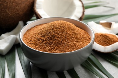 Photo of Natural coconut sugar in bowl on table