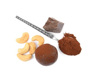 Photo of Delicious chocolate truffle with ingredients on white background, top view