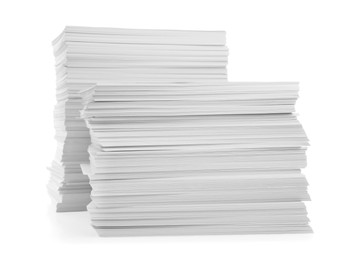 Photo of Stacks of paper sheets isolated on white