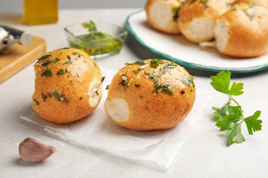 Traditional Ukrainian bread (Pampushky) with garlic on light table