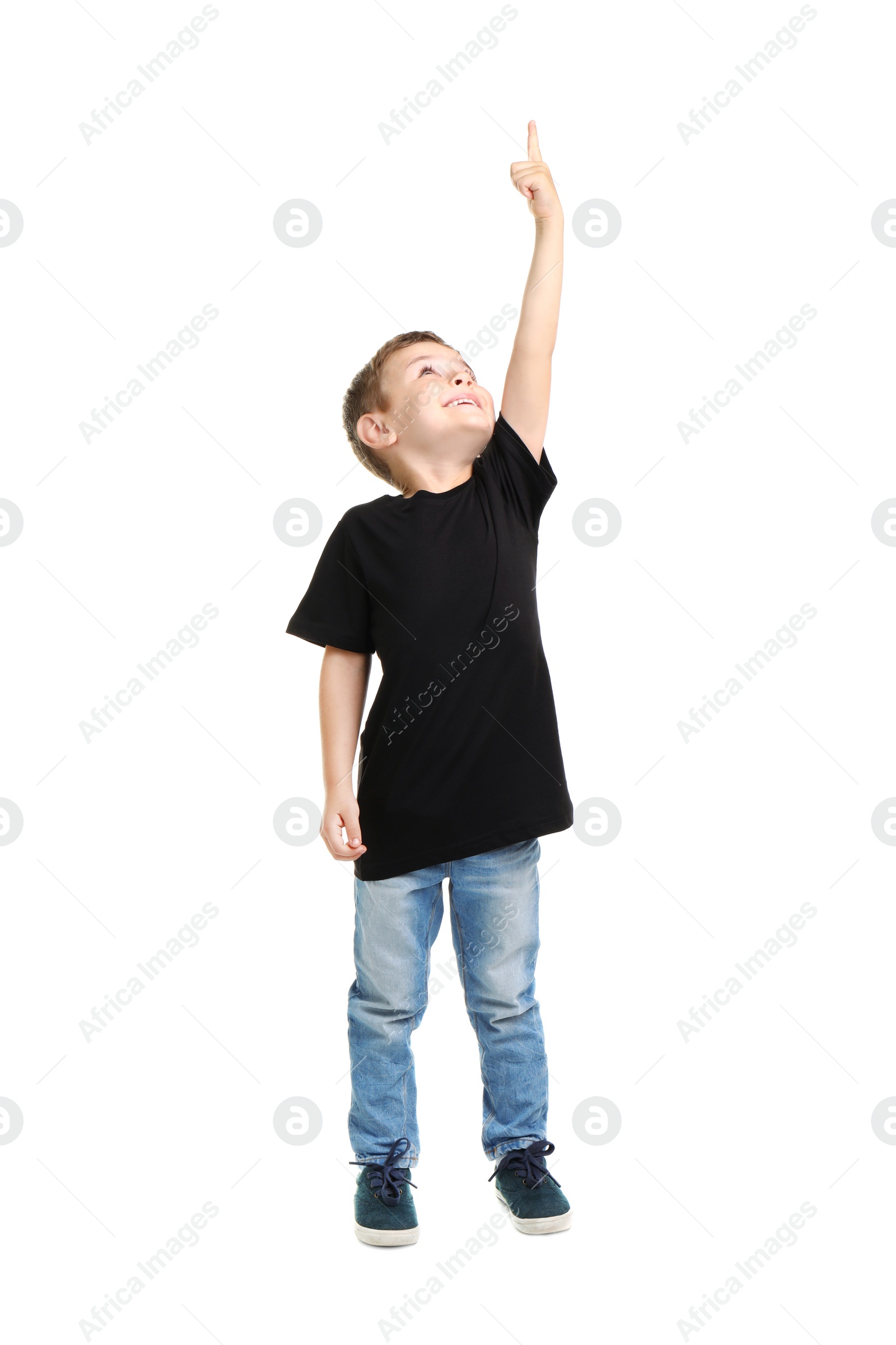 Photo of Little boy in t-shirt on white background. Mockup for design