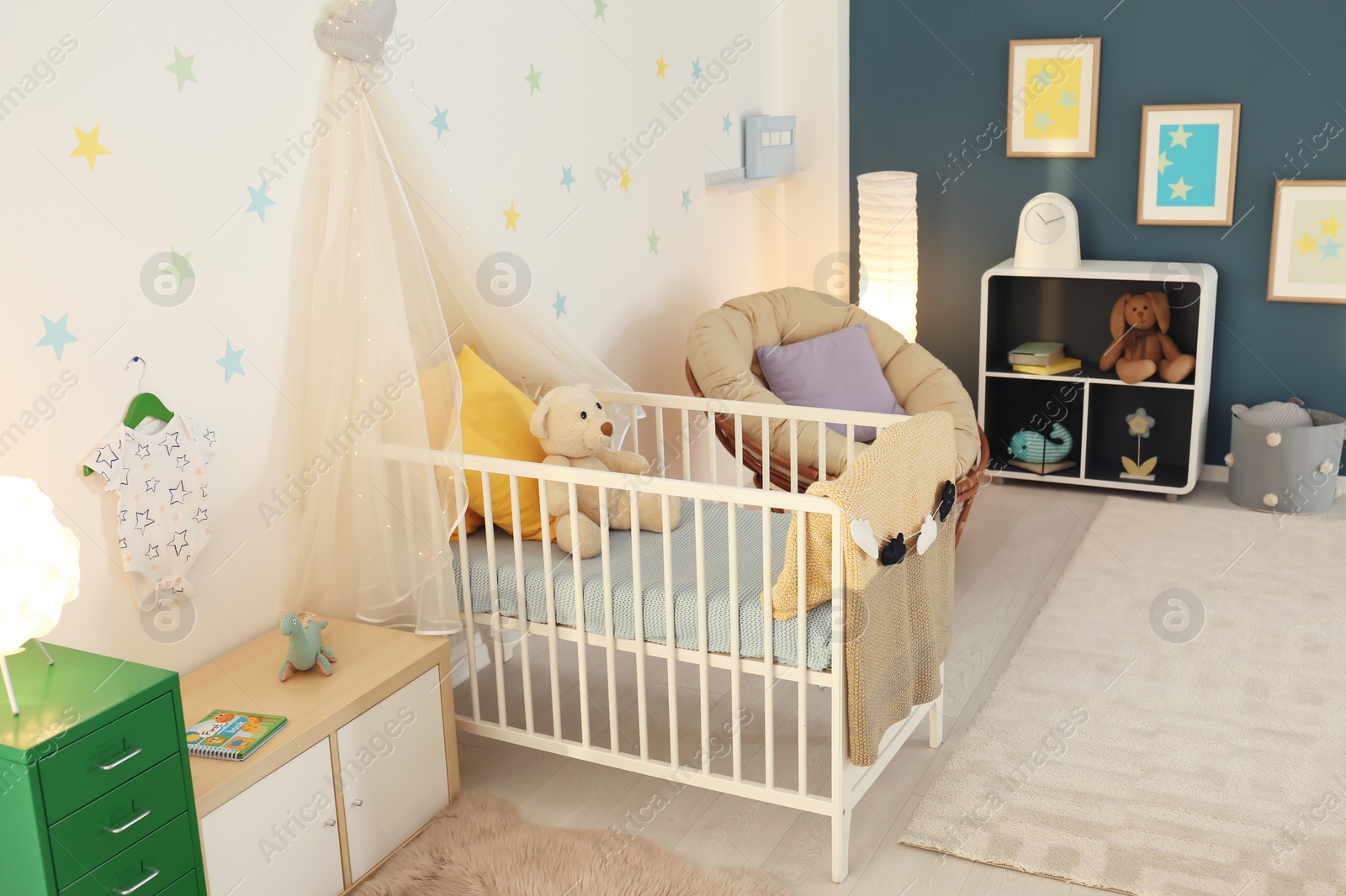 Photo of Stylish baby room interior with crib