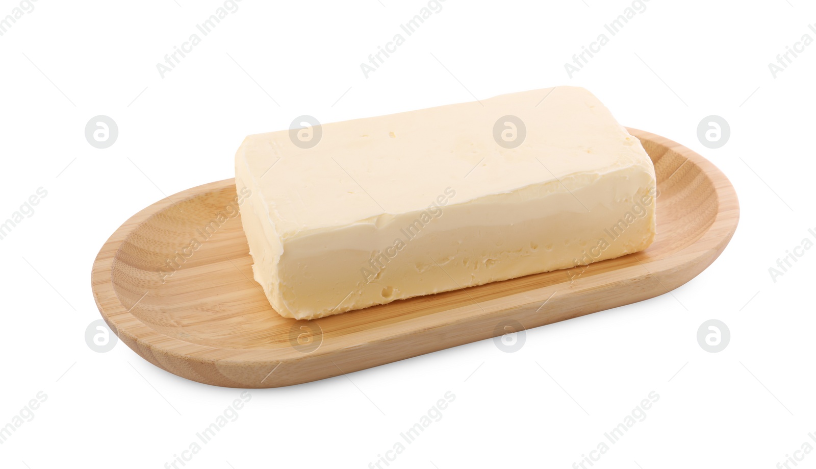 Photo of Block of tasty butter with wooden dish isolated on white