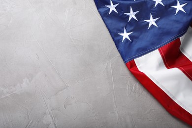 National flag of America on light grey table, top view. Space for text