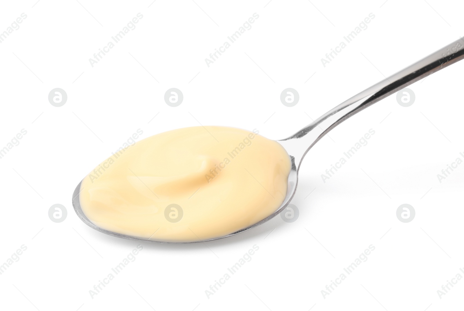 Photo of Spoon with delicious cheese sauce isolated on white