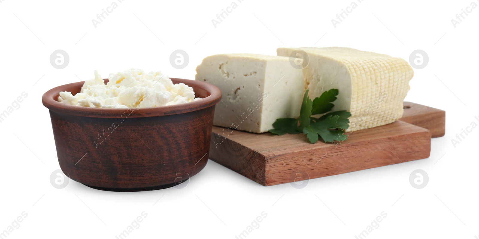 Photo of Different types of delicious tofu cheese with parsley on white background