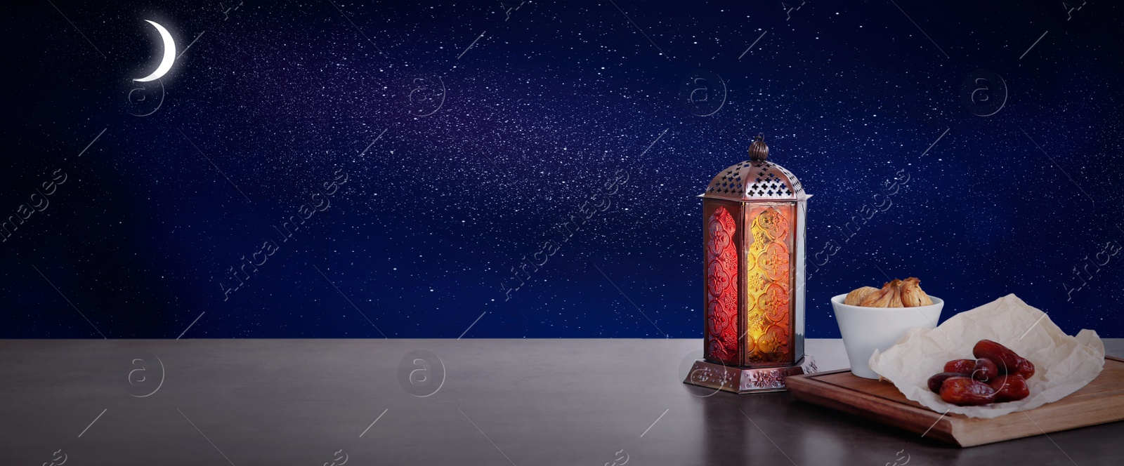 Image of Traditional Ramadan lantern and dry fruits on table, banner design. Muslim holiday