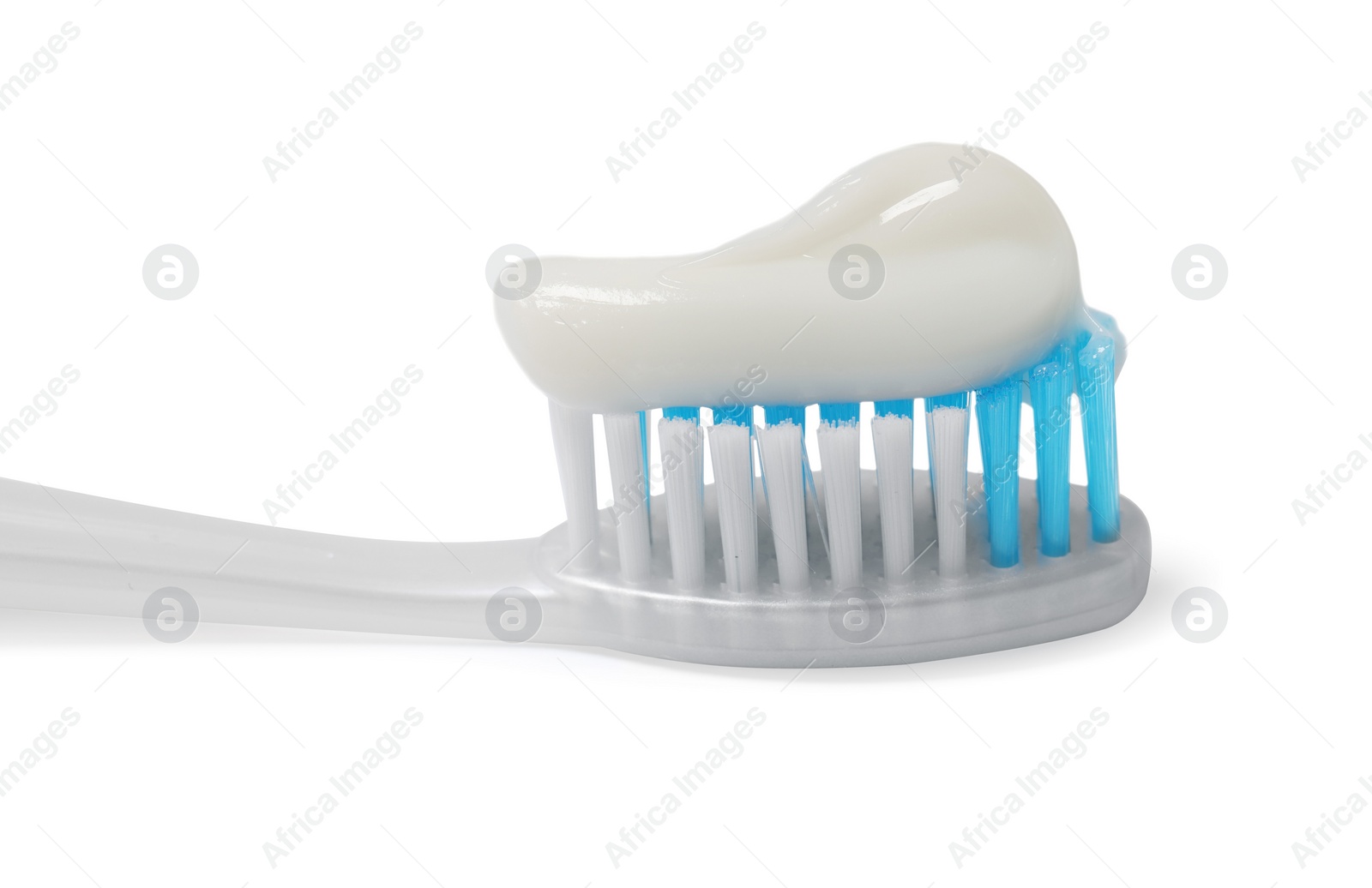 Photo of Plastic toothbrush with paste on white background, closeup