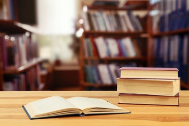 Image of Many books on wooden table in library