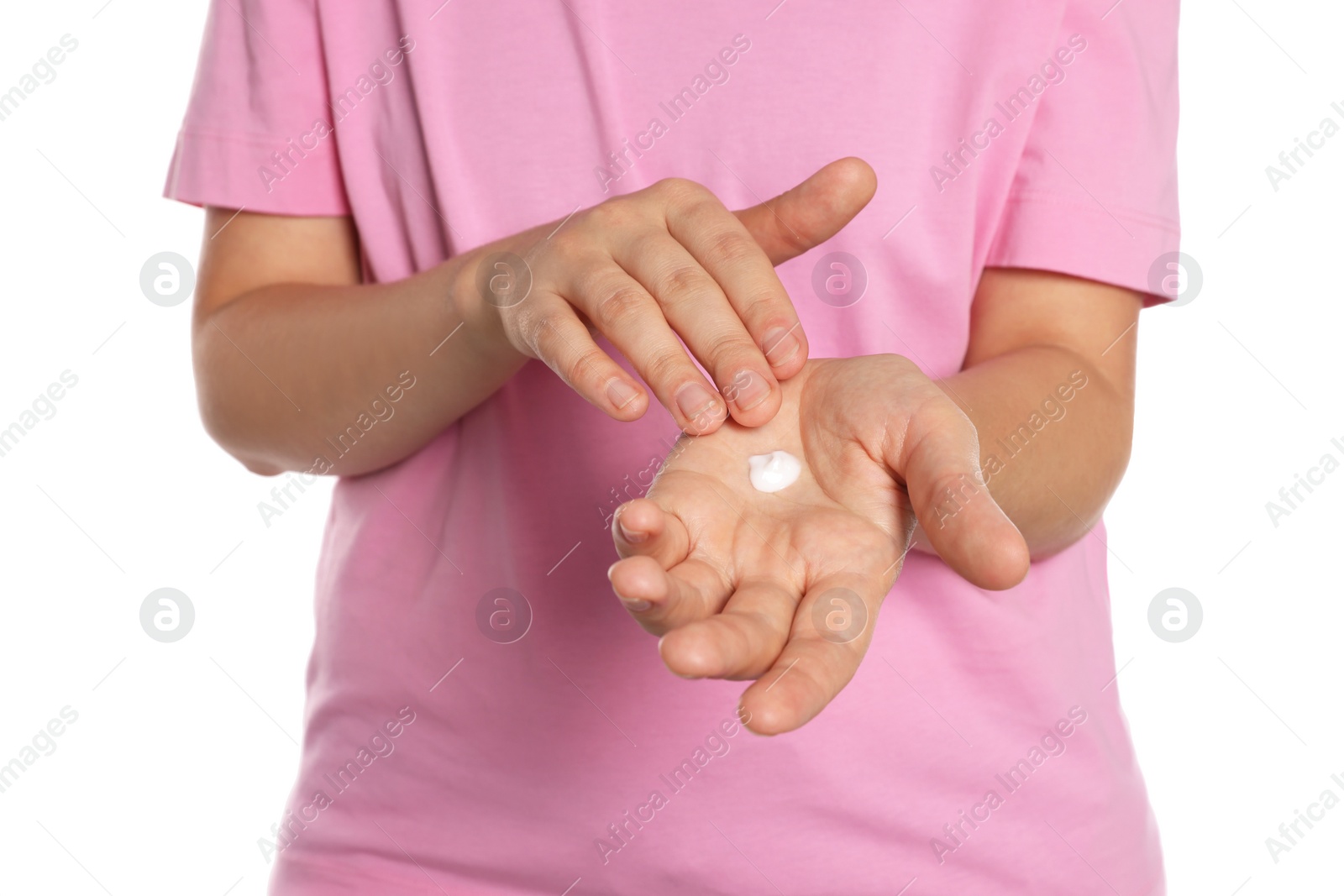 Photo of Woman applying cream on her hand against white background, closeup