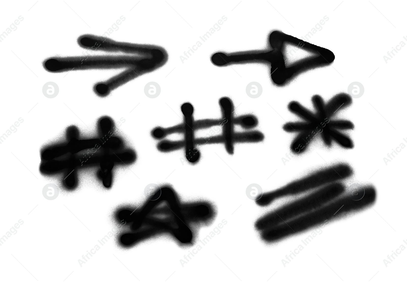 Photo of Symbols drawn by black spray paint on white background