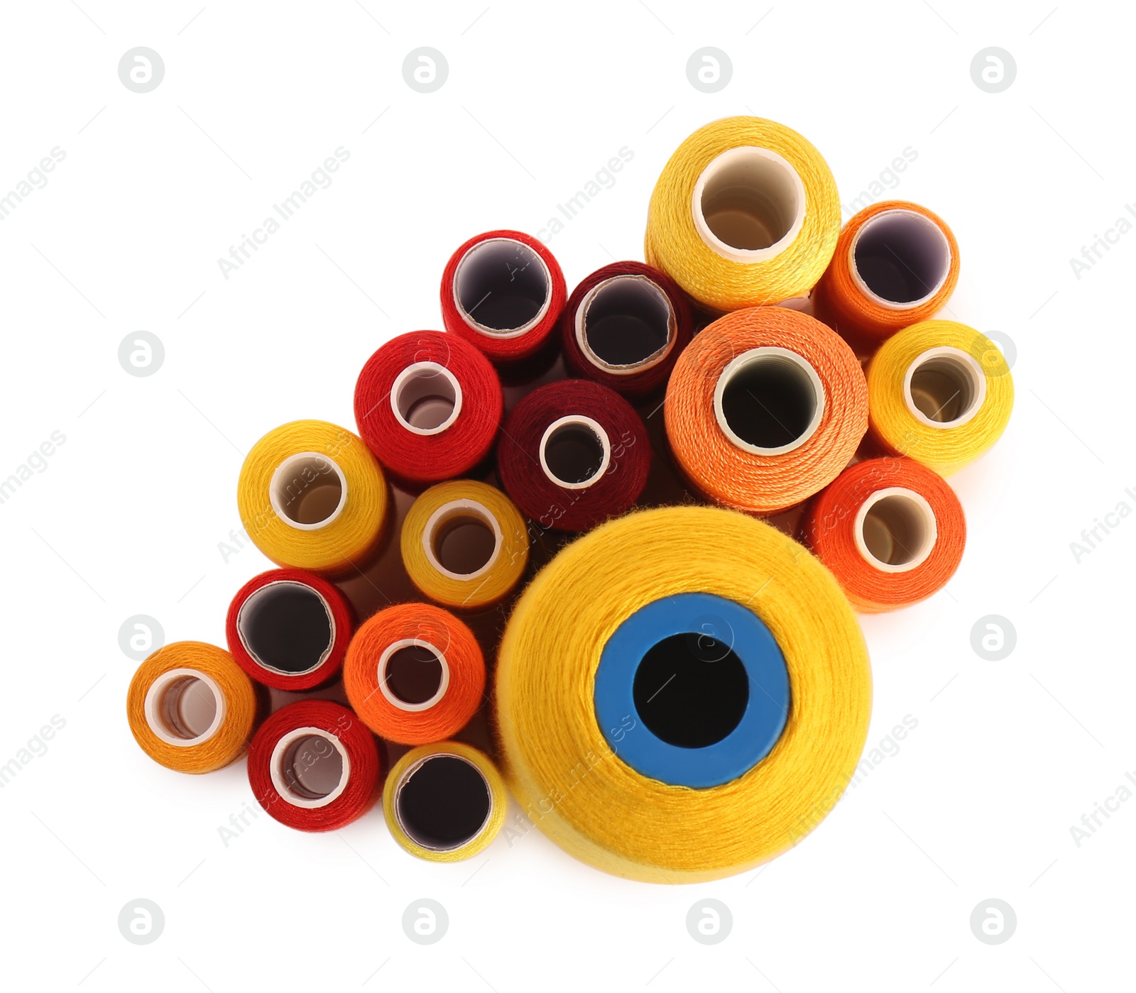 Photo of Set of colorful sewing threads on white background, top view