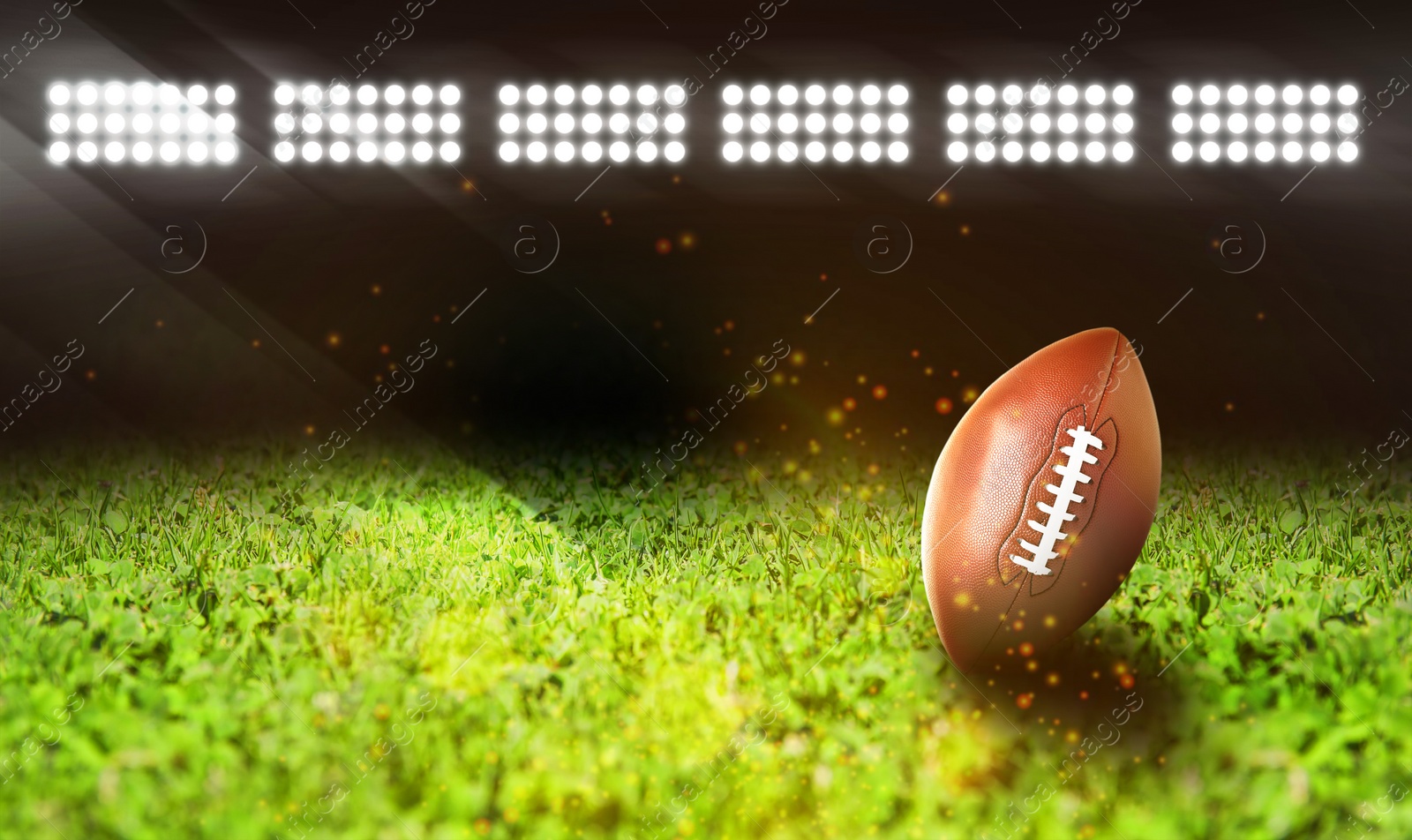 Image of Leather American ball on green football field, space for text 